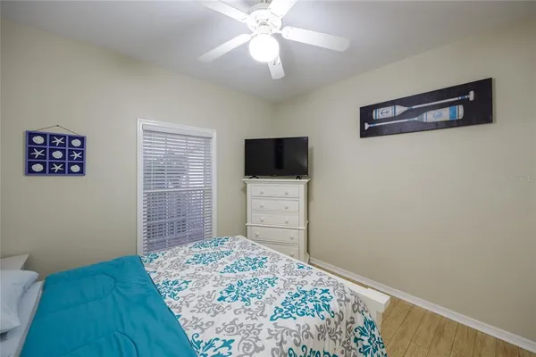 a bedroom with a bed and a table in it