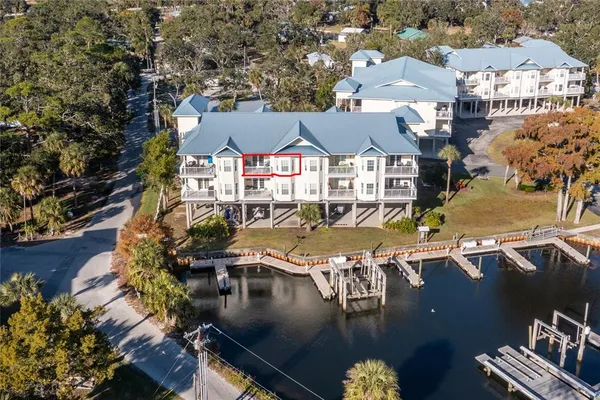 a view of a blue house with a ocean view