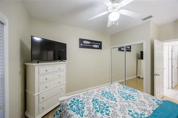 a bathroom with a granite countertop sink a toilet and a mirror