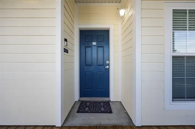 a kitchen with a white cabinets and white appliances