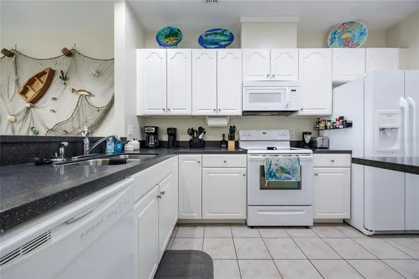 a kitchen with a stove and a refrigerator