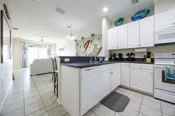 a kitchen with white cabinets