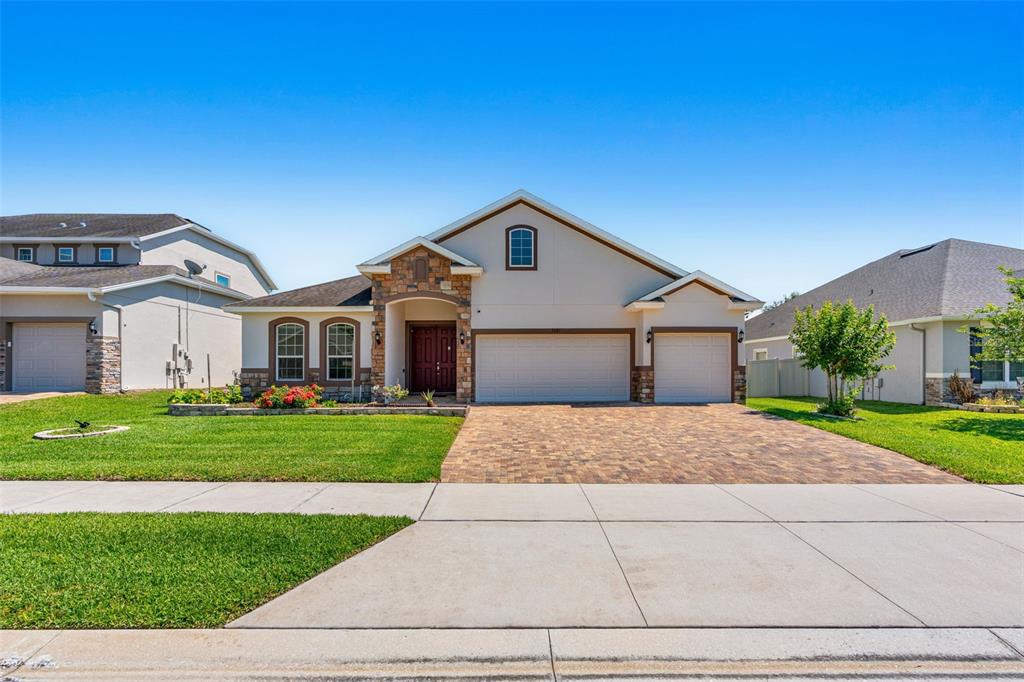 2085 Lula Road Minneola, FL 34715 - Photo 1 of 39 a front view of a house with a yard