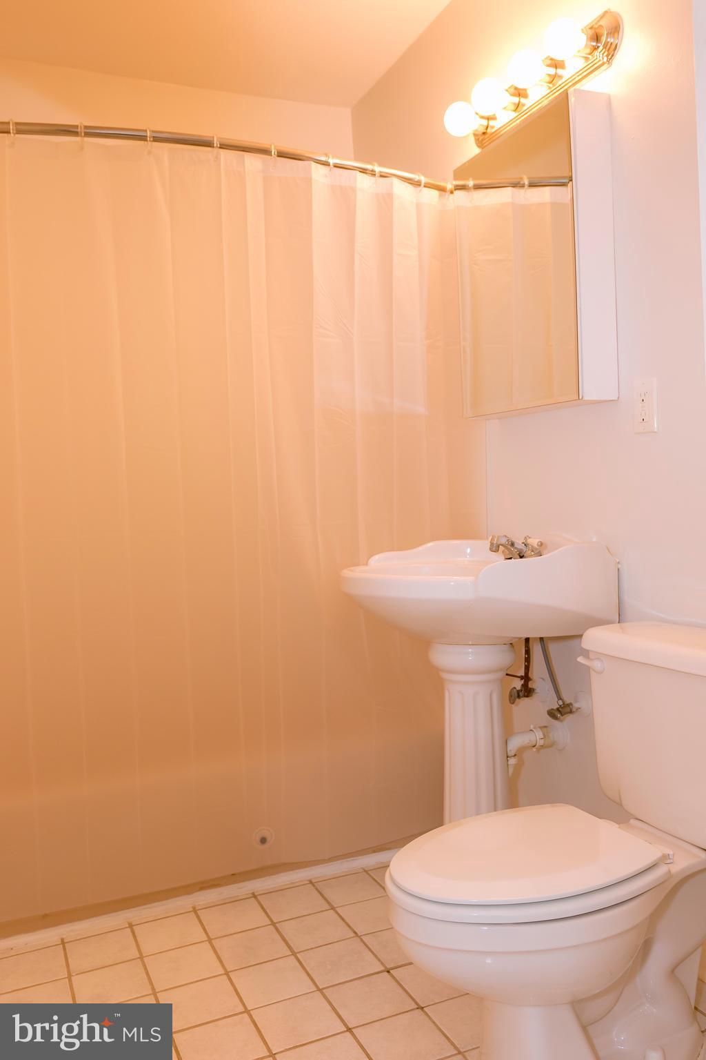 4141 Granby Road Woodbridge, VA 22193 - Photo 11 of 30 a bathroom with a sink a toilet and a mirror