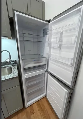 a view of walk in closet with empty racks