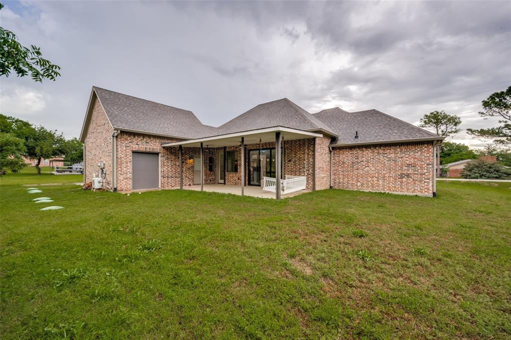 444 Ben Boyd Road Argyle, TX 76226 - Photo 27 of 28 a view of a house with a garden