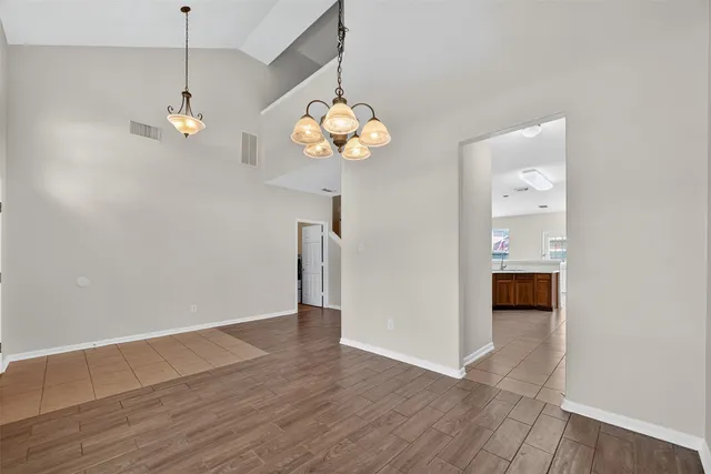 a view of an entryway with wooden floor