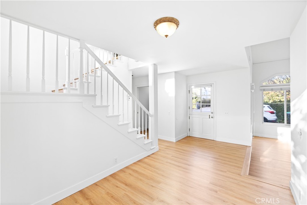1597 Riverside Place Costa Mesa, CA 92627 - Photo 11 of 37 a view of an entryway with wooden floor
