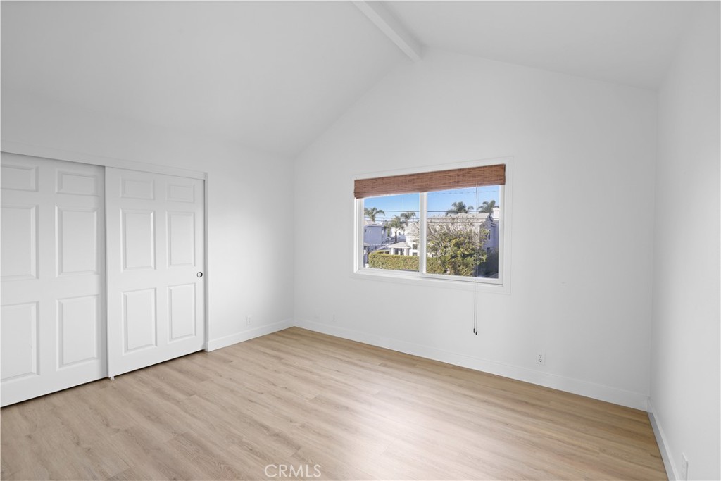 1597 Riverside Place Costa Mesa, CA 92627 - Photo 18 of 37 a view of an empty room with wooden floor and closet