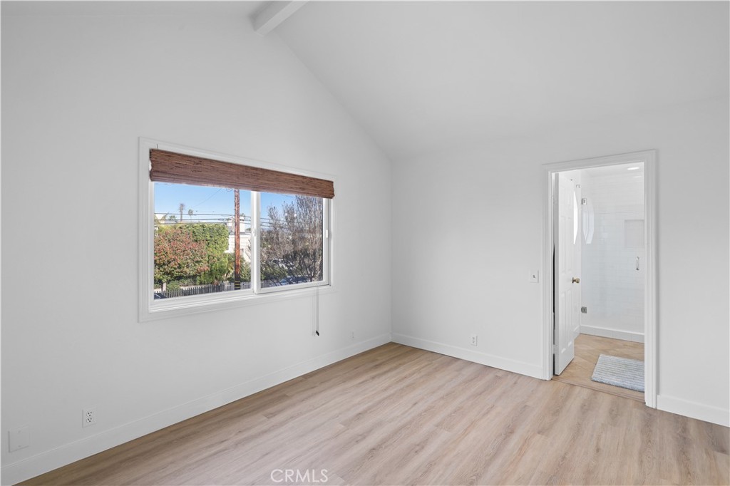 1597 Riverside Place Costa Mesa, CA 92627 - Photo 20 of 37 an empty room with wooden floor and windows