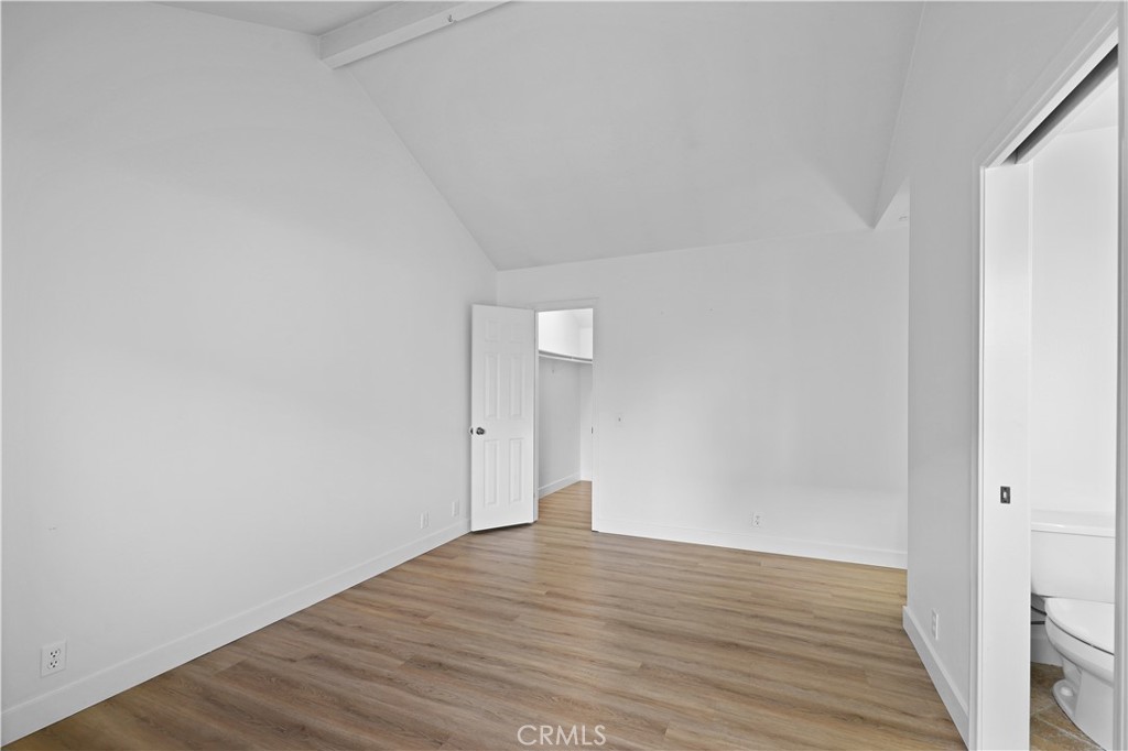 1597 Riverside Place Costa Mesa, CA 92627 - Photo 24 of 37 a view of an empty room with wooden floor