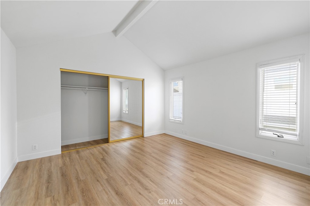1597 Riverside Place Costa Mesa, CA 92627 - Photo 28 of 37 a view of an empty room with wooden floor and a window