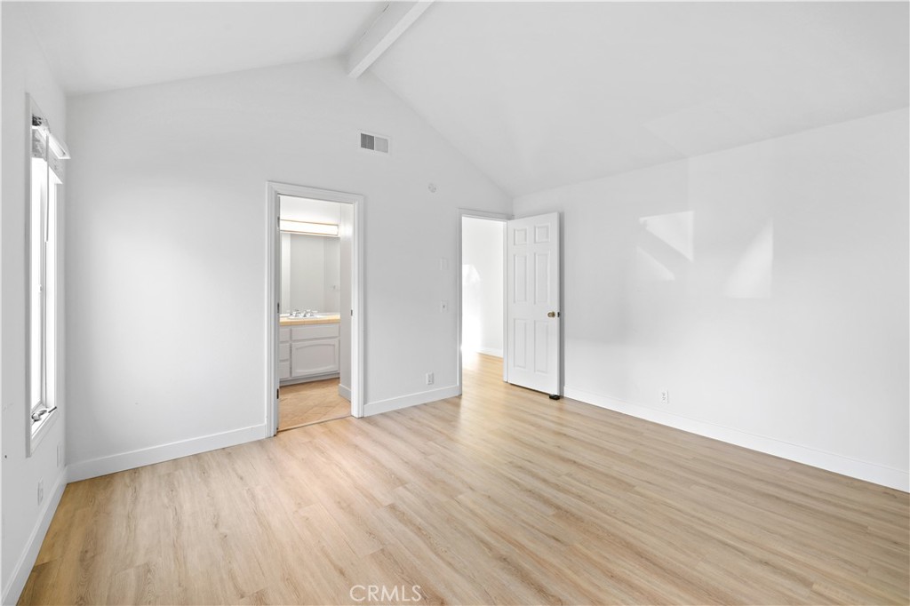 1597 Riverside Place Costa Mesa, CA 92627 - Photo 30 of 37 a view of an empty room with wooden floor