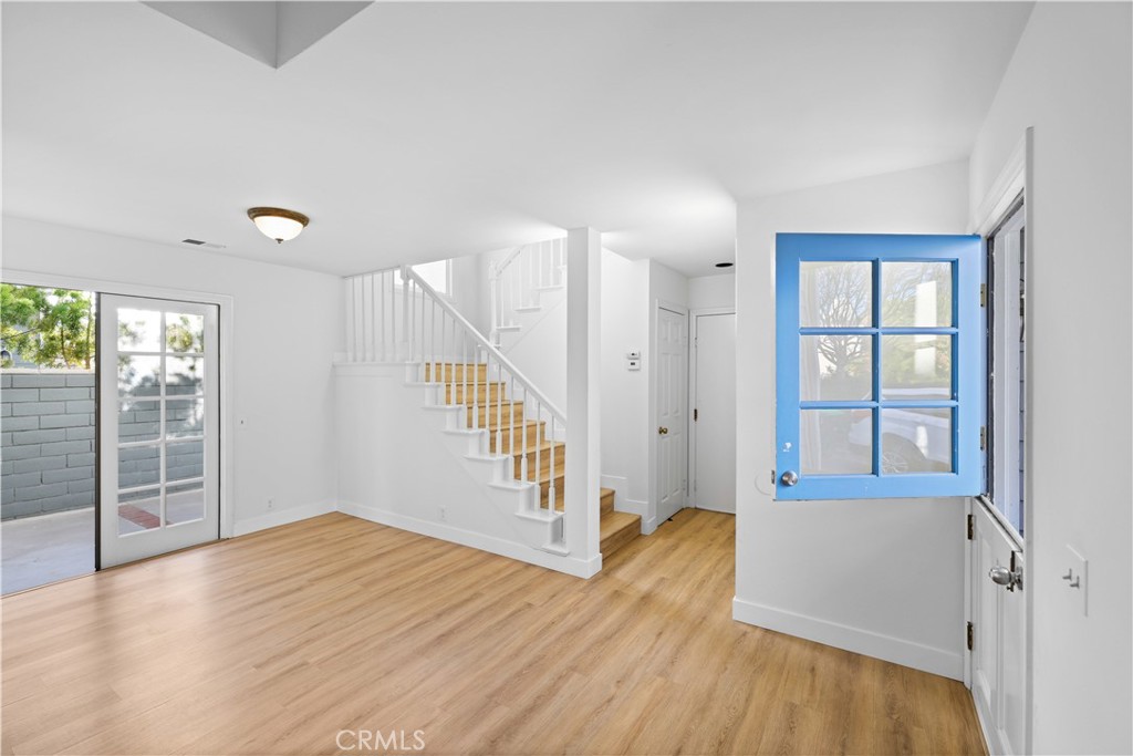 1597 Riverside Place Costa Mesa, CA 92627 - Photo 4 of 37 wooden floor in an empty room with a window