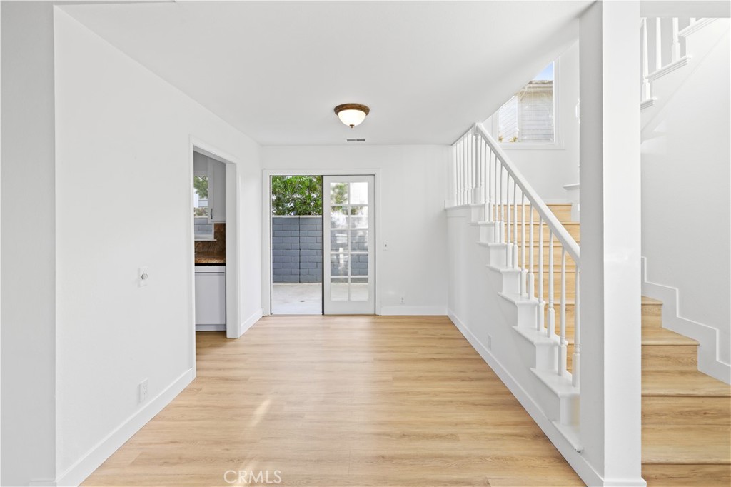 1597 Riverside Place Costa Mesa, CA 92627 - Photo 10 of 37 a view of an entryway with wooden floor