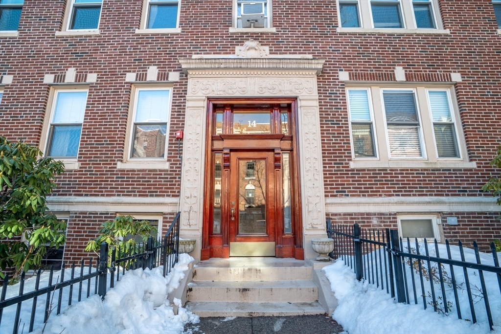 14 James Street, Unit 3 Brookline, MA 02446 - Photo 10 of 12 a front view of a brick house with many windows