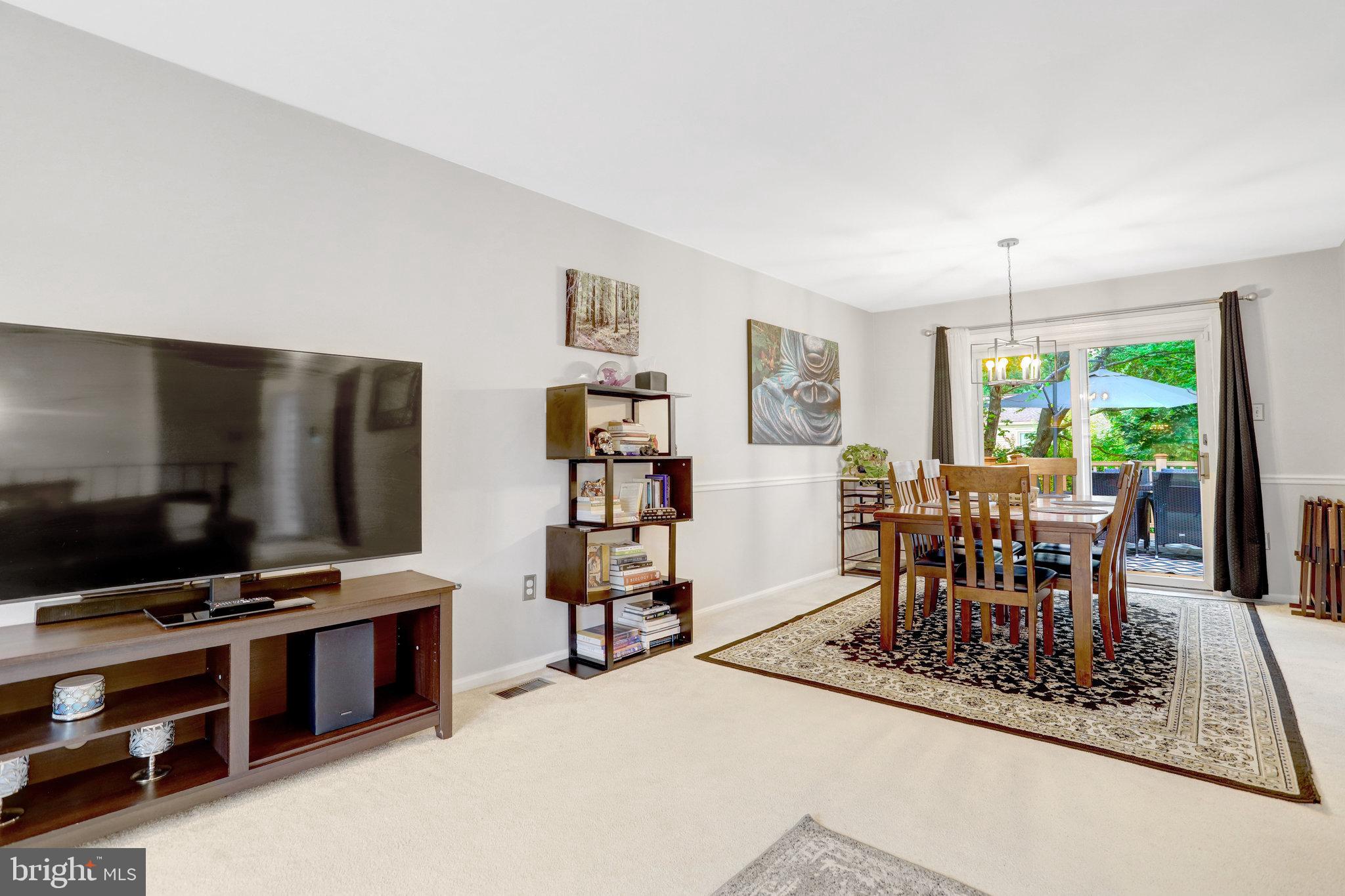4518 Flintstone Road Alexandria, VA 22306 - Photo 12 of 62 a dining room with furniture and chandelier