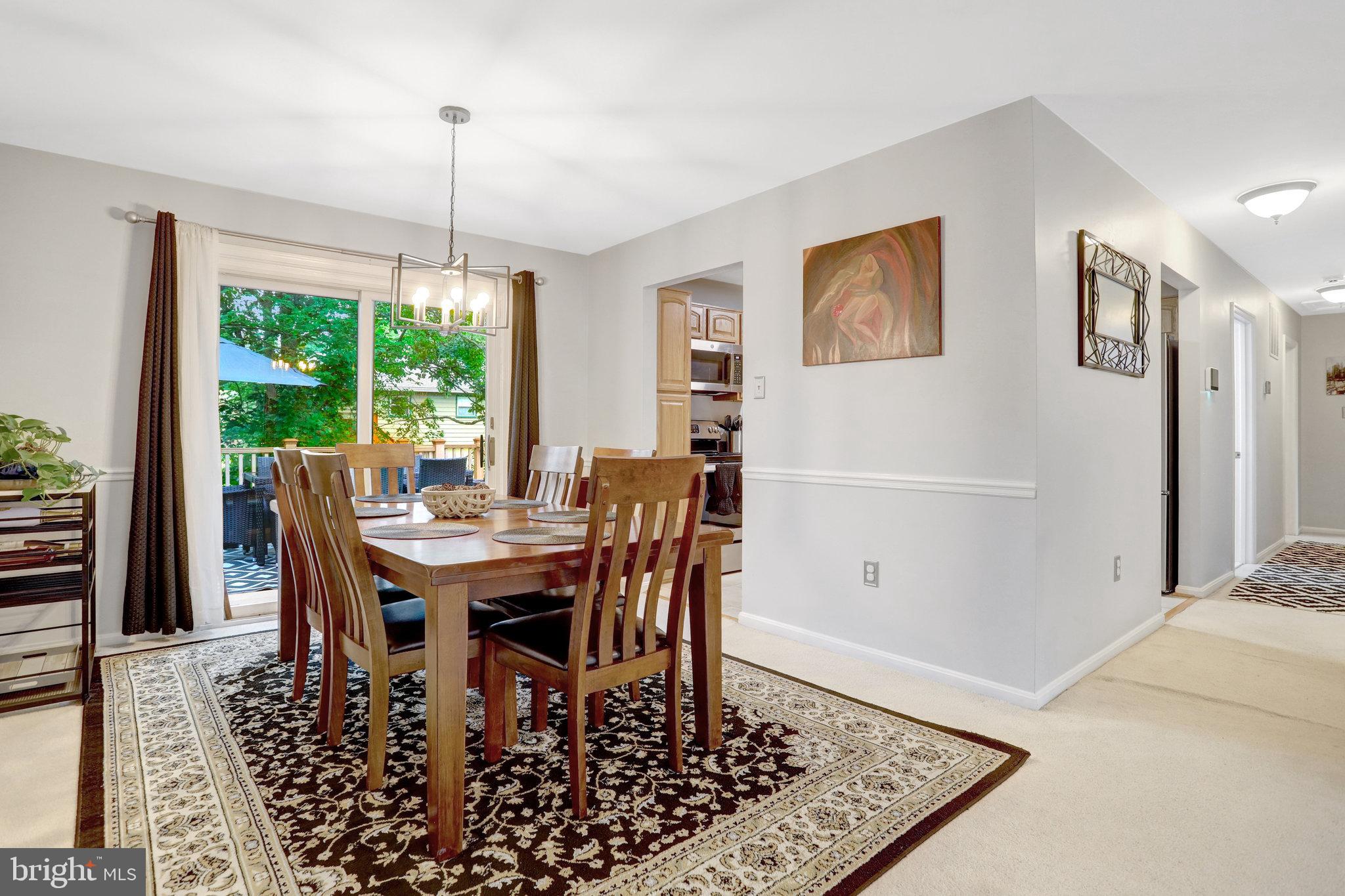 4518 Flintstone Road Alexandria, VA 22306 - Photo 14 of 62 a view of a dining room with furniture window and wooden floor