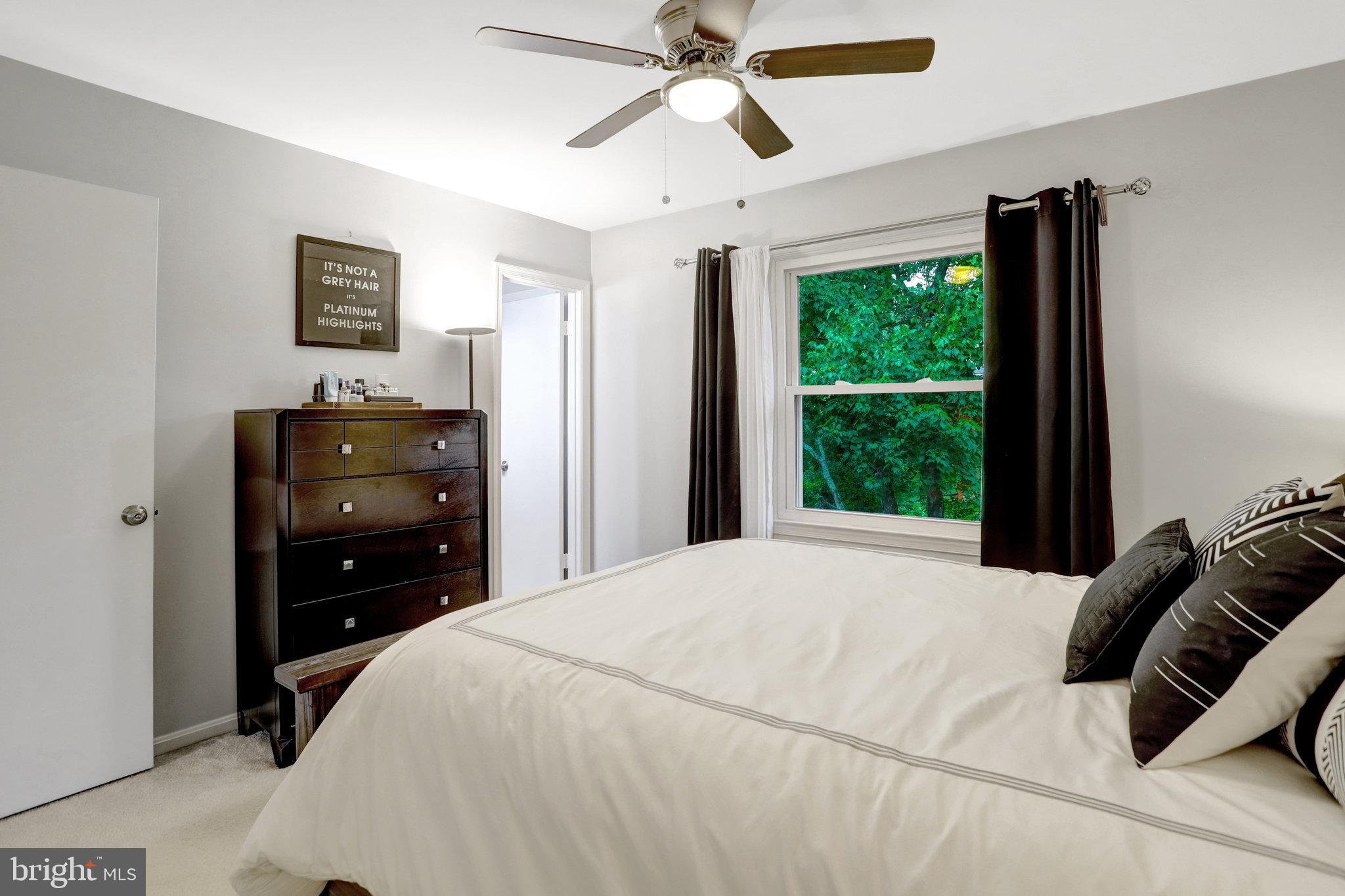 4518 Flintstone Road Alexandria, VA 22306 - Photo 23 of 62 a bedroom with a bed and a window