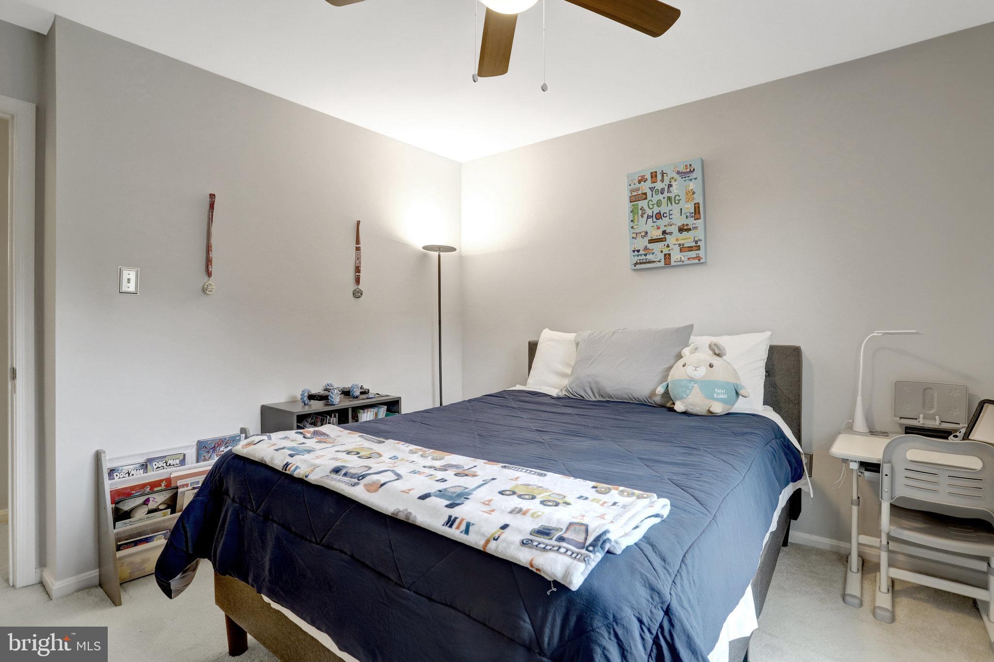 4518 Flintstone Road Alexandria, VA 22306 - Photo 30 of 62 a bedroom with a bed and a dresser
