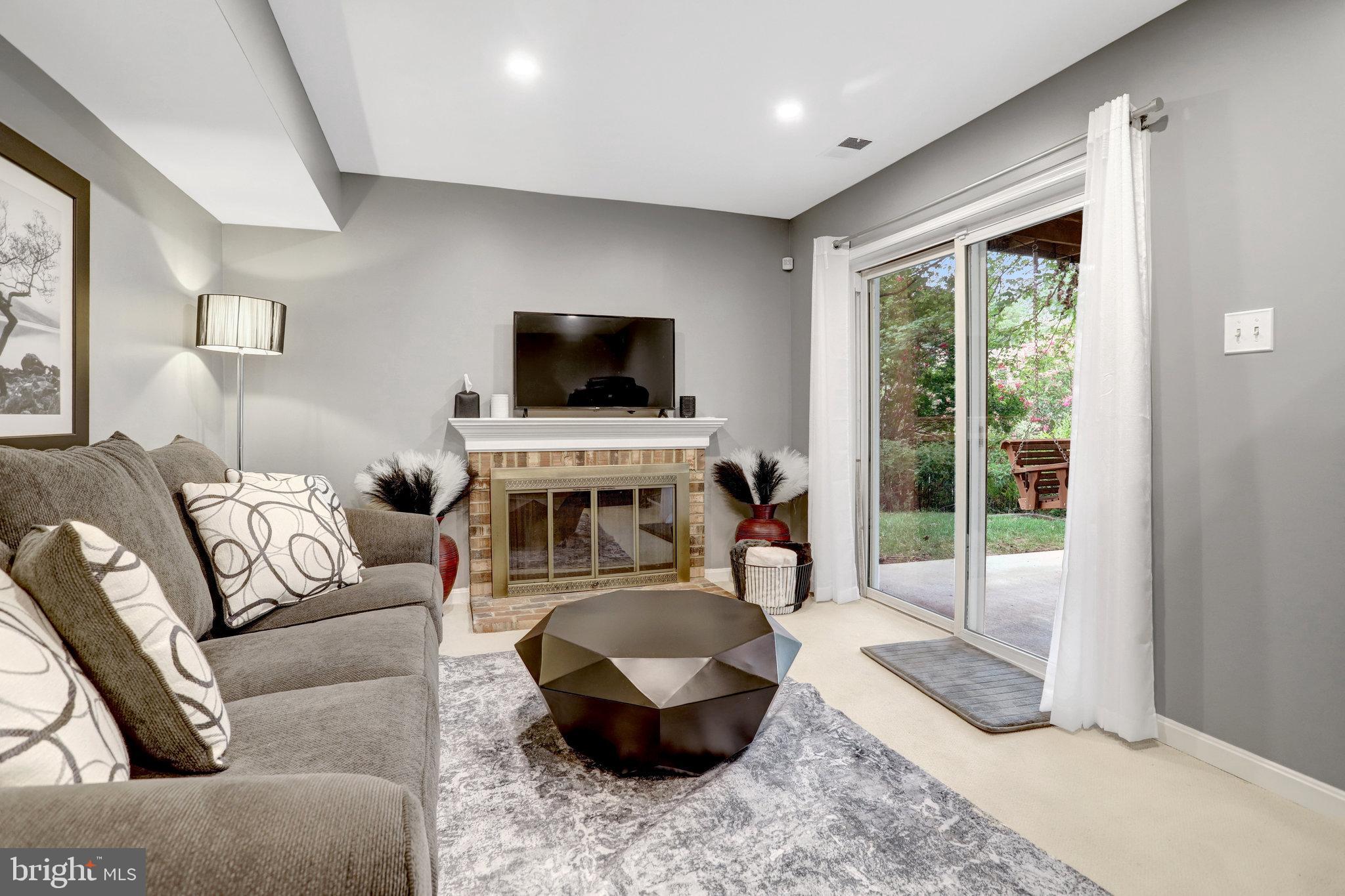 4518 Flintstone Road Alexandria, VA 22306 - Photo 39 of 62 a living room with furniture and a flat screen tv