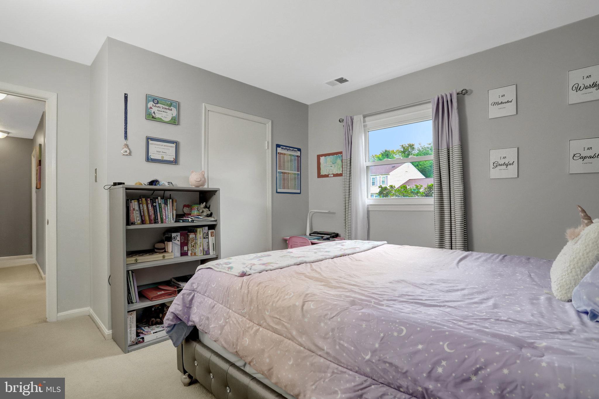 4518 Flintstone Road Alexandria, VA 22306 - Photo 43 of 62 a bedroom with a bed and painting on the wall