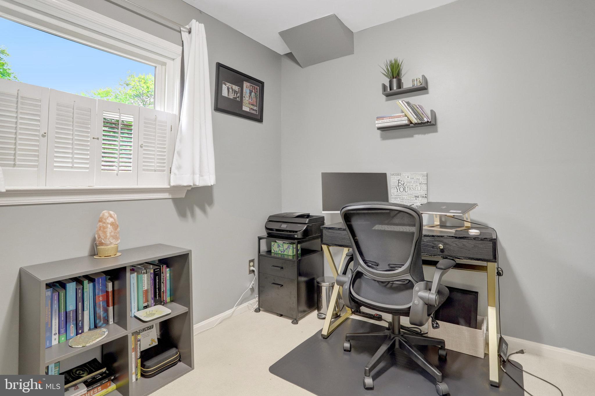 4518 Flintstone Road Alexandria, VA 22306 - Photo 46 of 62 a view of a workspace with furniture and a window