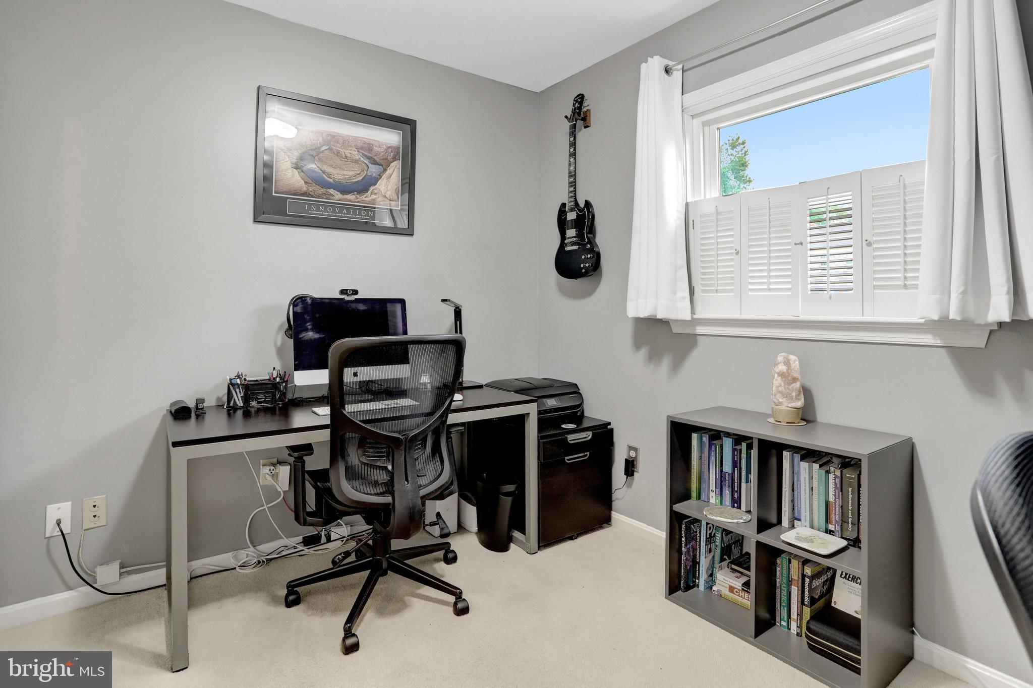 4518 Flintstone Road Alexandria, VA 22306 - Photo 47 of 62 a view of a workspace with furniture and a window