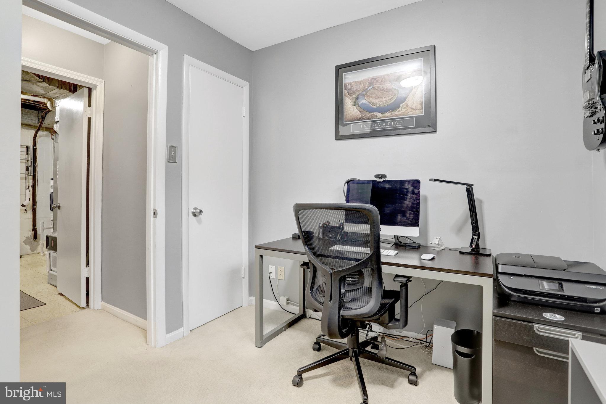 4518 Flintstone Road Alexandria, VA 22306 - Photo 48 of 62 a view of a workspace with furniture and a window