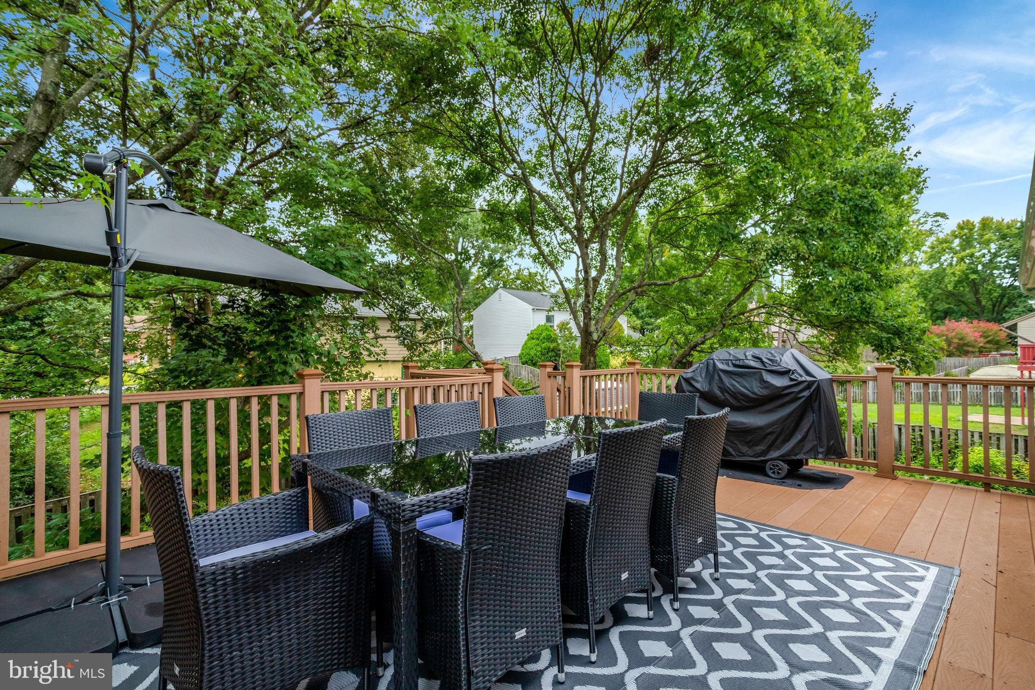 4518 Flintstone Road Alexandria, VA 22306 - Photo 53 of 62 a view of a balcony with chairs and wooden fence