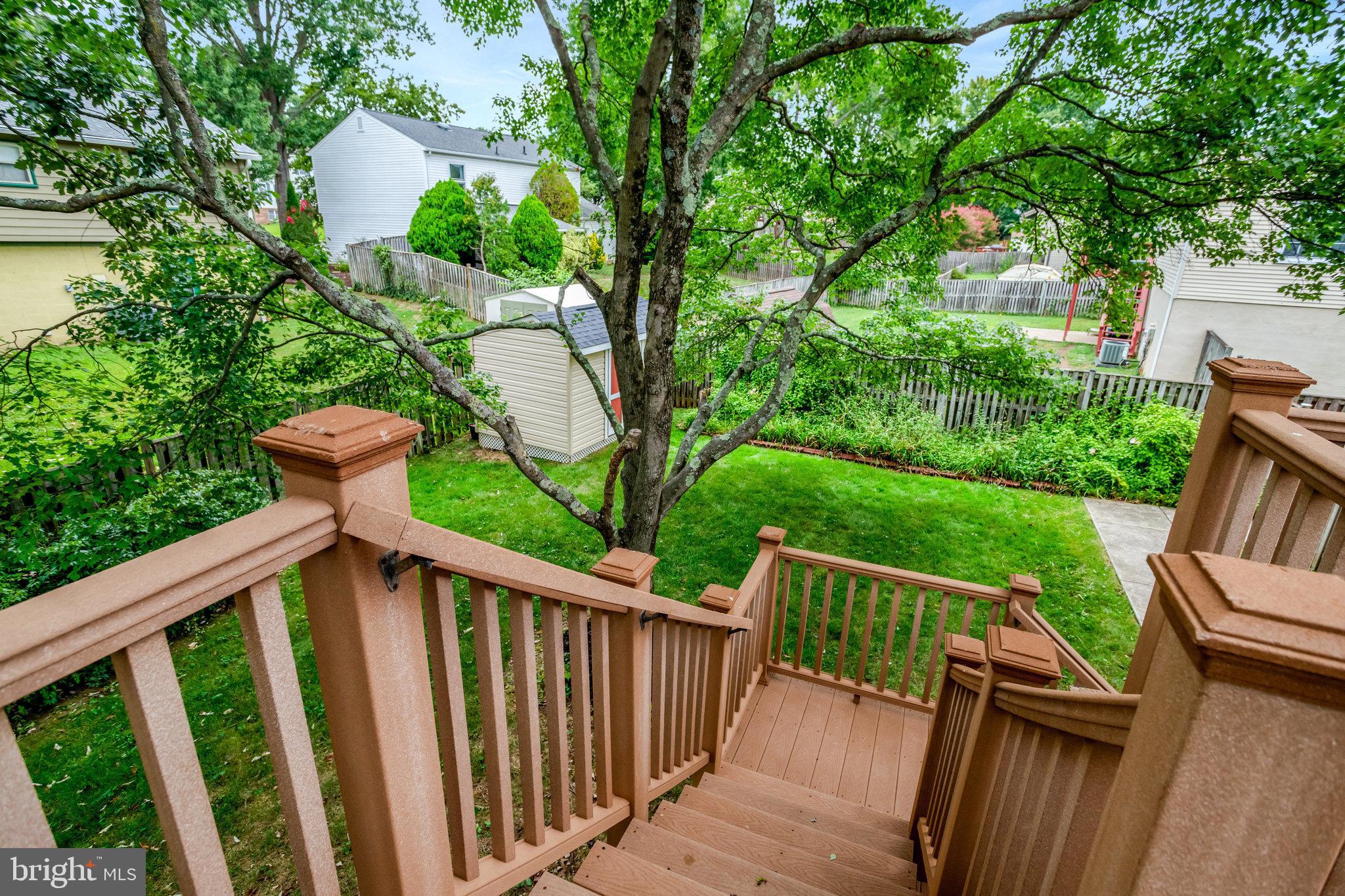 4518 Flintstone Road Alexandria, VA 22306 - Photo 55 of 62 a view of a deck with a large window and wooden fence