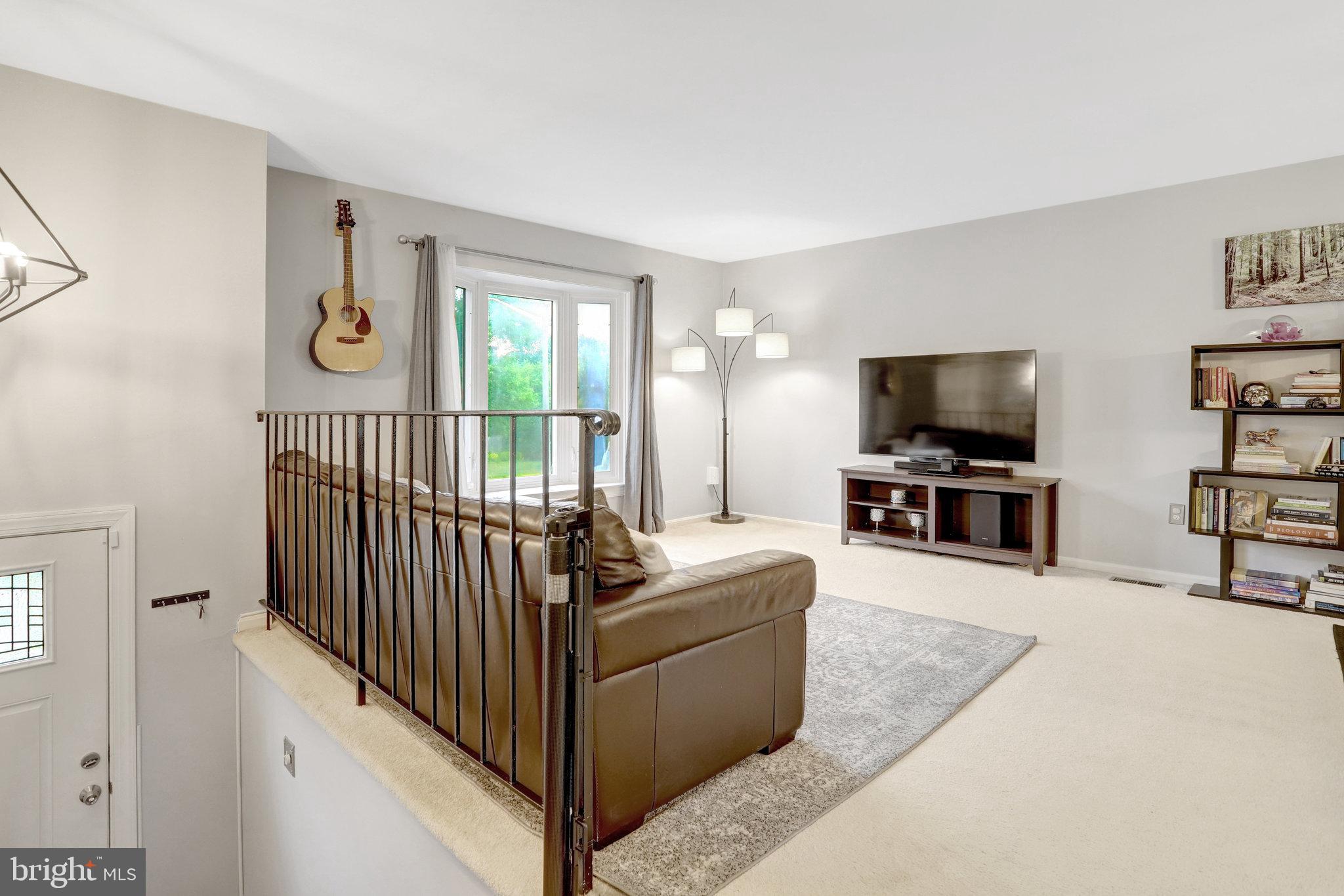 4518 Flintstone Road Alexandria, VA 22306 - Photo 8 of 62 a living room with furniture and a flat screen tv