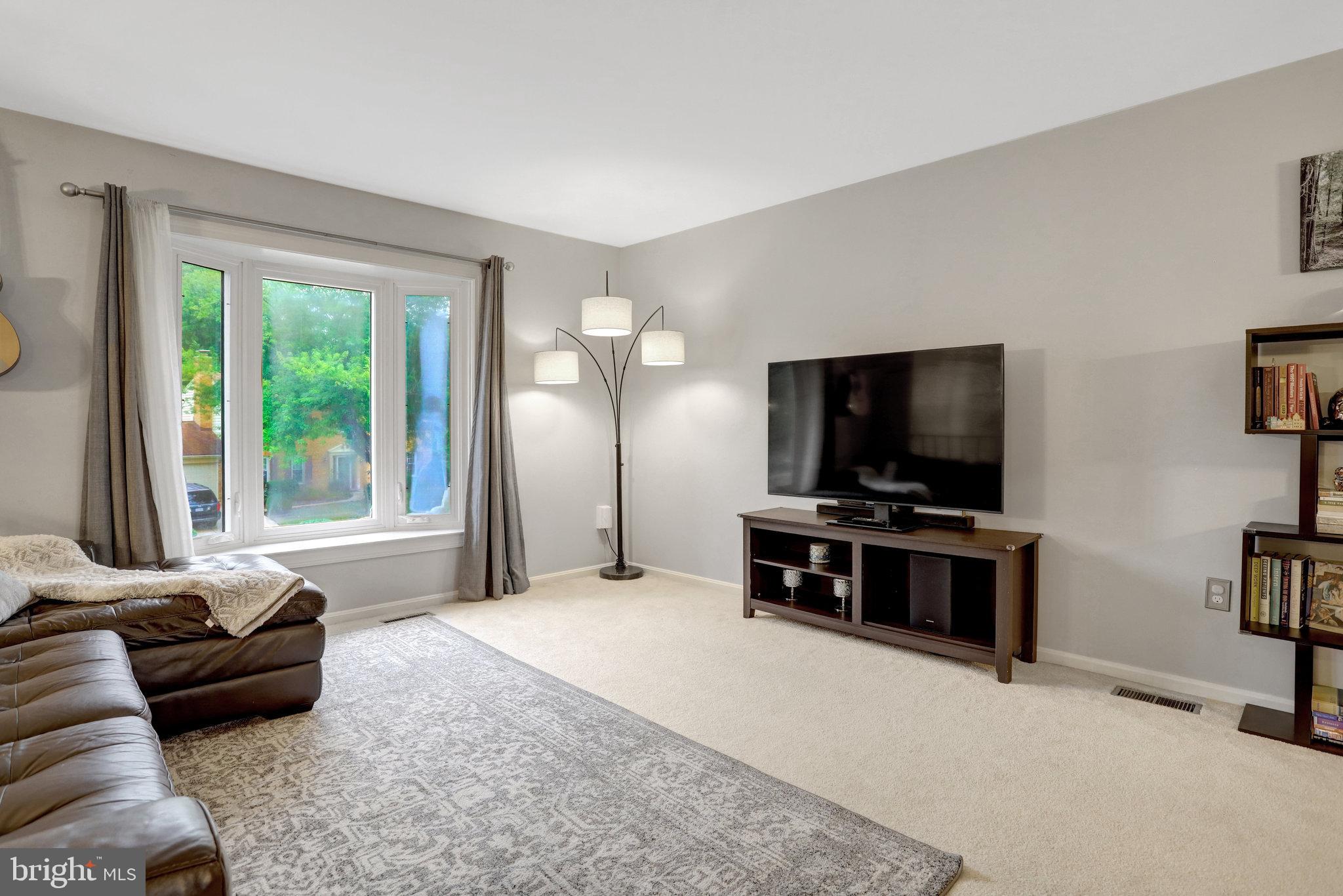 4518 Flintstone Road Alexandria, VA 22306 - Photo 9 of 62 a living room with furniture and a flat screen tv