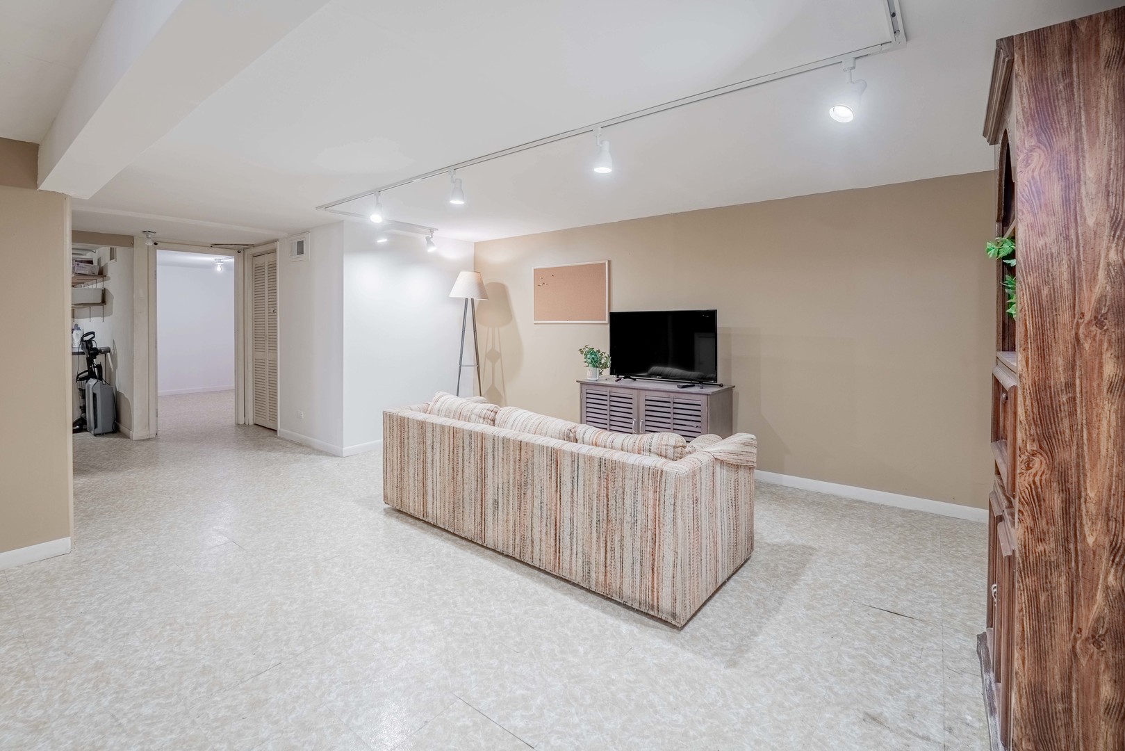 3632 Harlem Avenue Riverside, IL 60546 - Photo 12 of 26 a view of a room with furniture and a flat screen tv