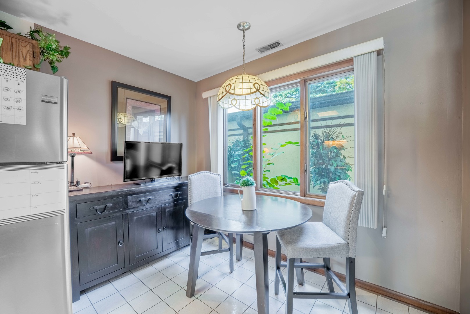 3632 Harlem Avenue Riverside, IL 60546 - Photo 7 of 26 a view of a dining room with furniture window and outside view
