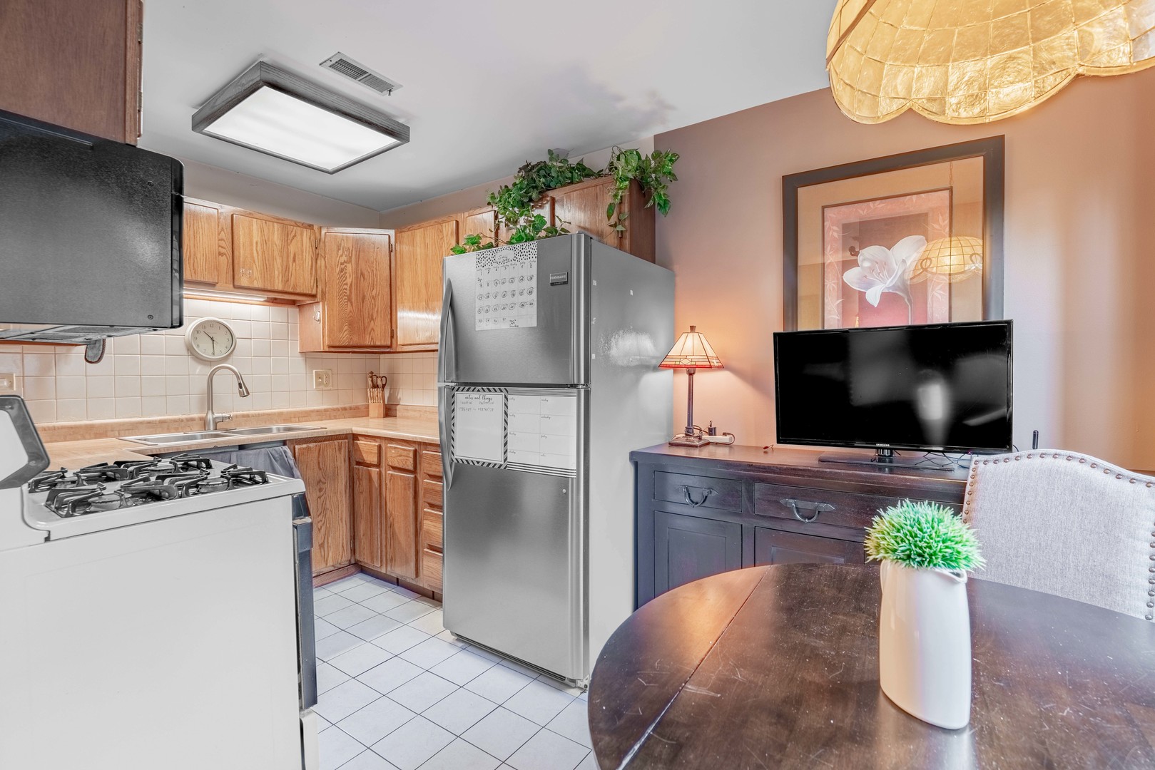 3632 Harlem Avenue Riverside, IL 60546 - Photo 9 of 26 a kitchen with stainless steel appliances a stove a refrigerator and a microwave