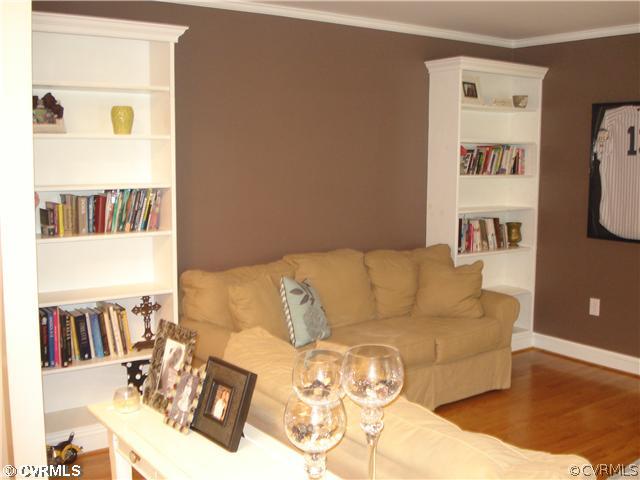 4025 Poplar Grove Road Midlothian, VA 23112 - Photo 2 of 12 a living room with furniture and a book shelf