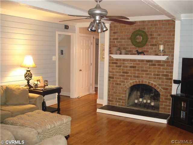 4025 Poplar Grove Road Midlothian, VA 23112 - Photo 4 of 12 a living room with furniture and a fireplace