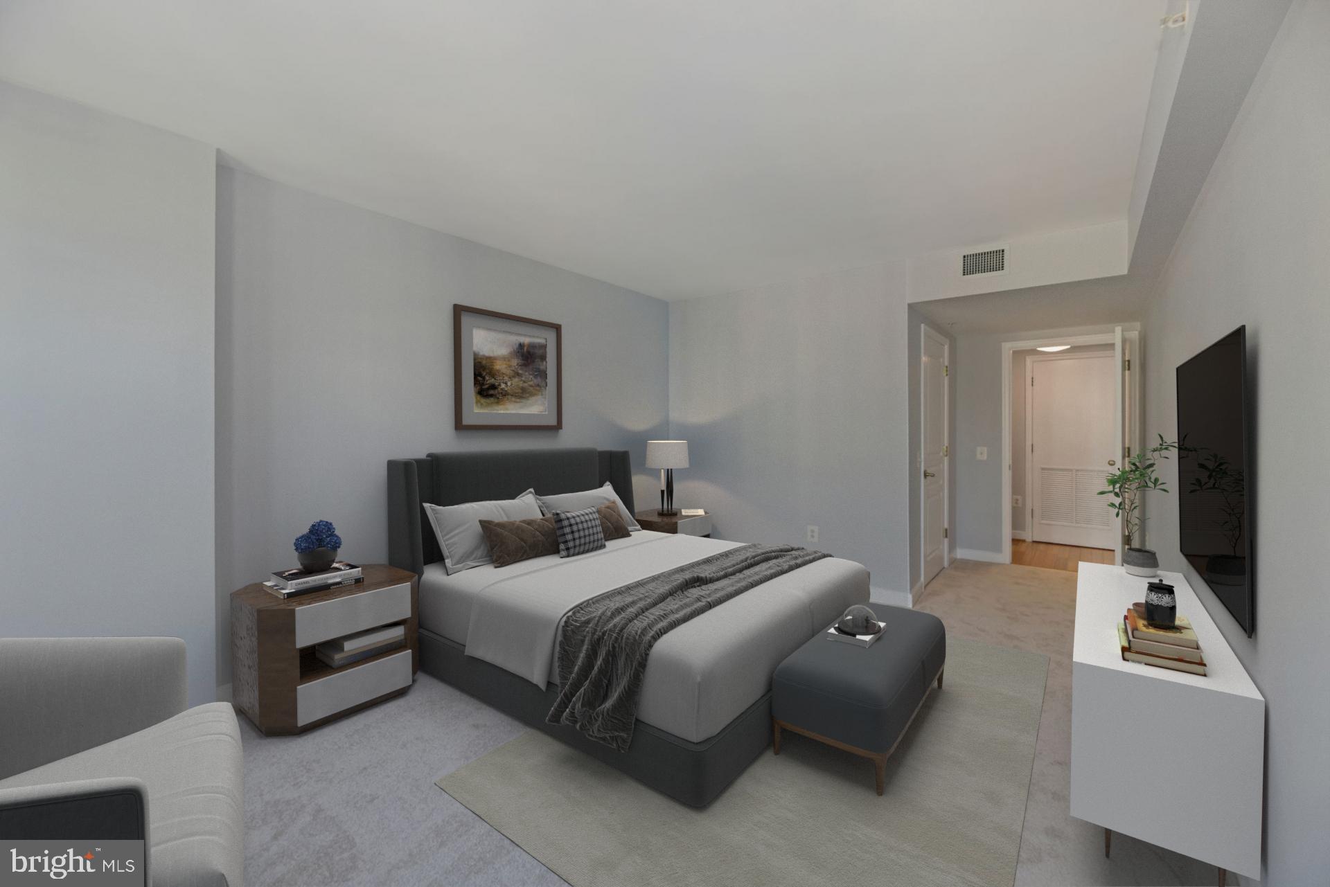 616 E Street Northwest, Unit 1020 Washington, DC 20004 - Photo 10 of 23 a bedroom with a bed and a flat screen tv