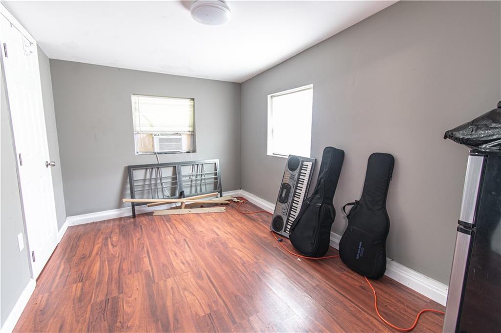 5646 Price Road Gainesville, GA 30506 - Photo 10 of 11 a view of room with furniture and wooden floor