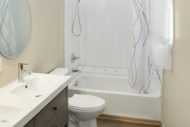 a bathroom with a sink a toilet and a bathtub