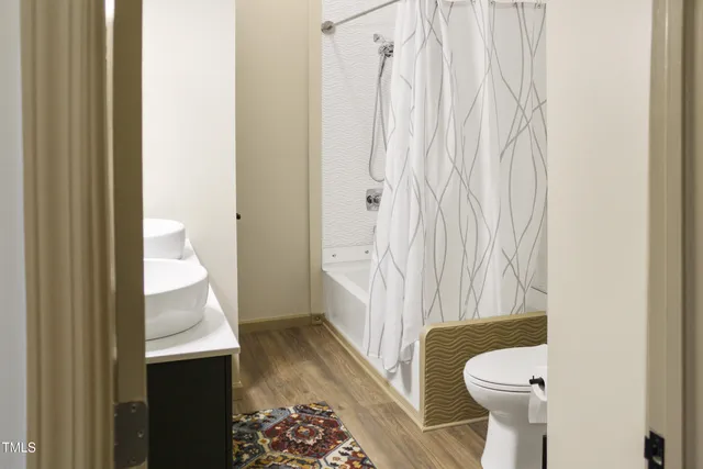 a bathroom with a sink and toilet