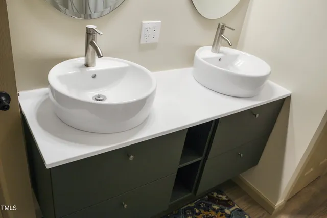 a bathroom with a sink and a mirror