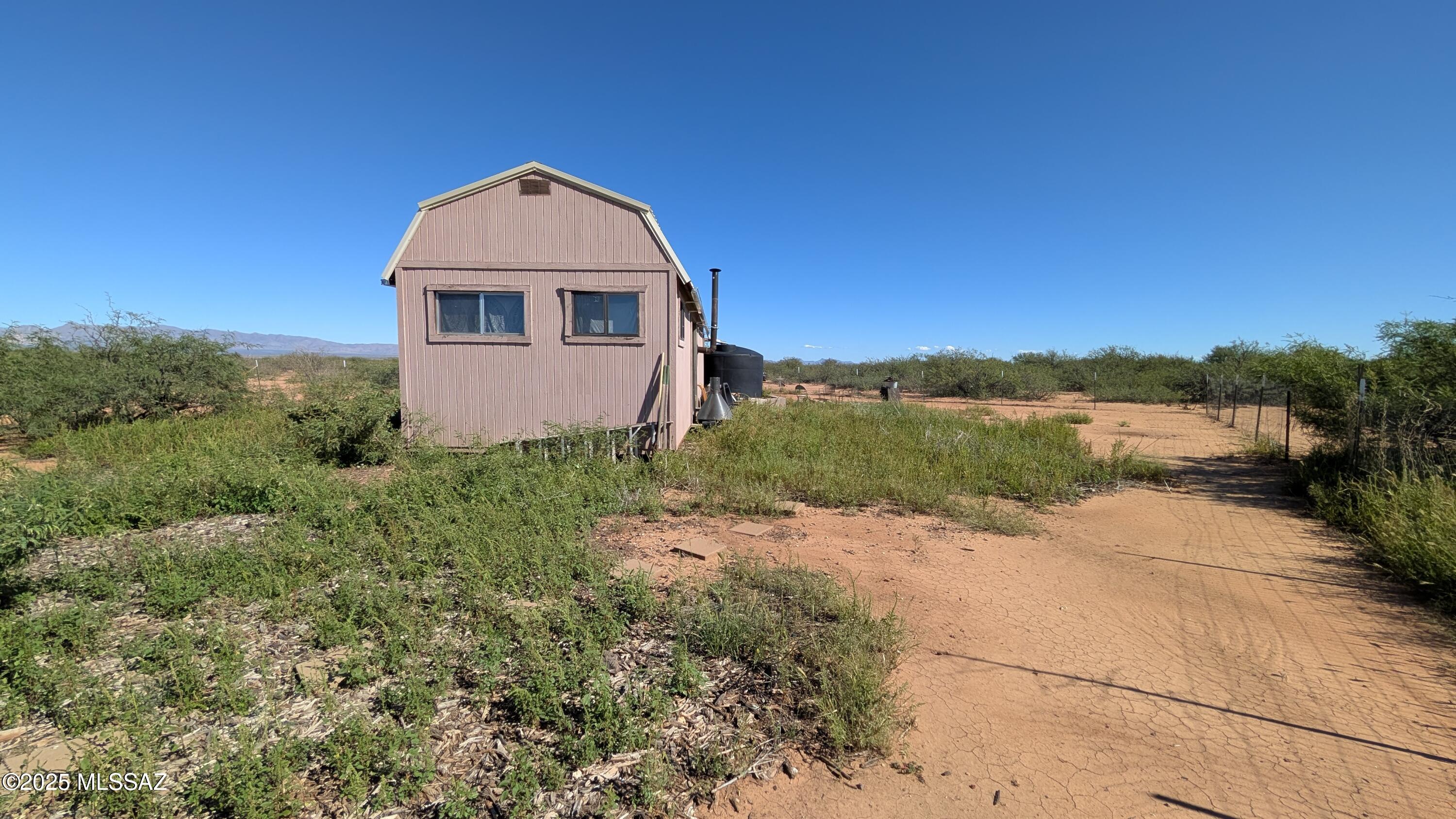 Tbd North Westward Trail, Unit 9 McNeal, AZ 85617 - Photo 23 of 37 a view of a small house with a yard