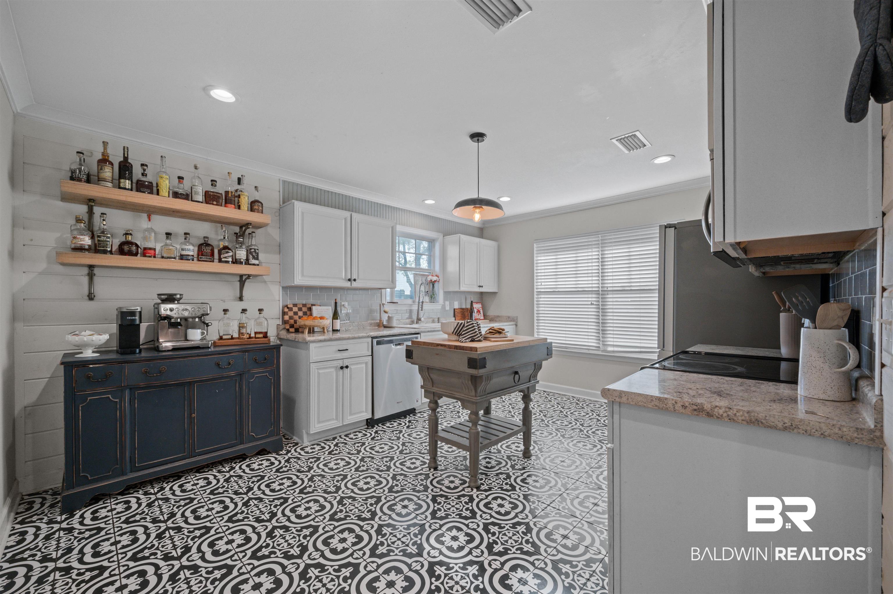 22370 Buck Road Robertsdale, AL 36567 - Photo 11 of 31 Kitchen with white cabinetry, tasteful backsplash, crown molding, open shelves, and stainless steel dishwasher