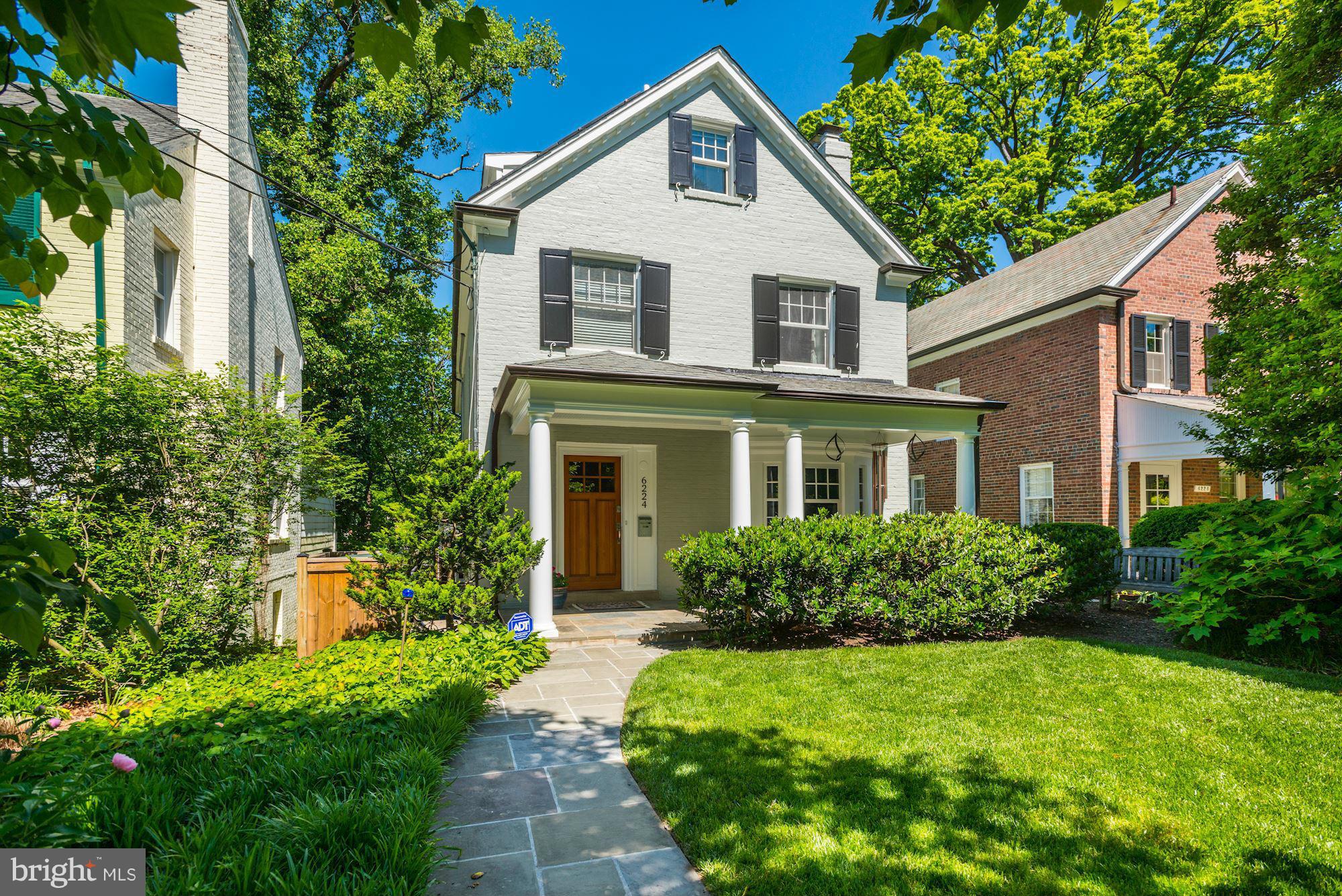 6224 30th Street Northwest Washington, DC 20015 - Photo 1 of 30 a front view of a house with a yard and trees