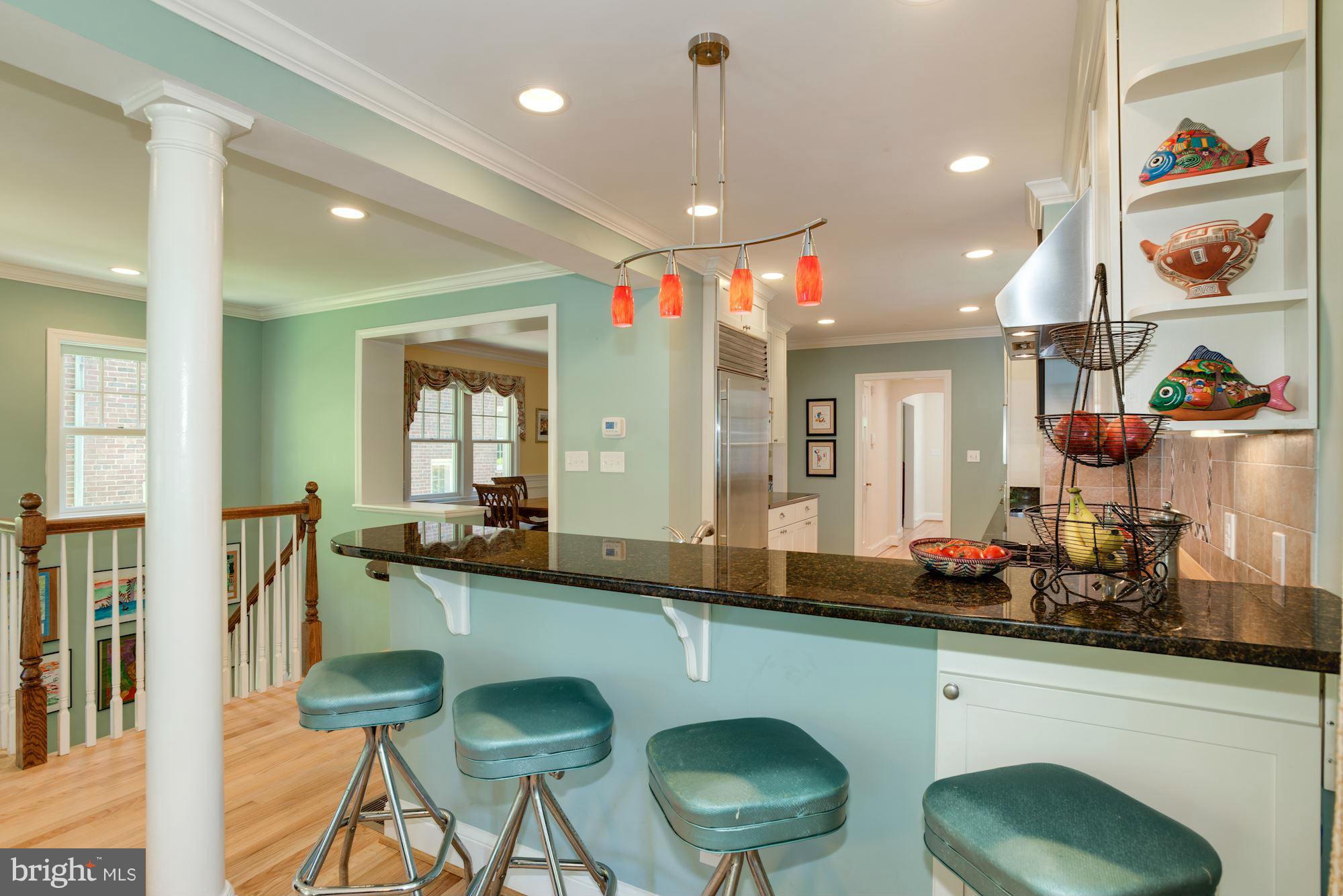 6224 30th Street Northwest Washington, DC 20015 - Photo 11 of 30 a kitchen with a sink cabinets and dining table