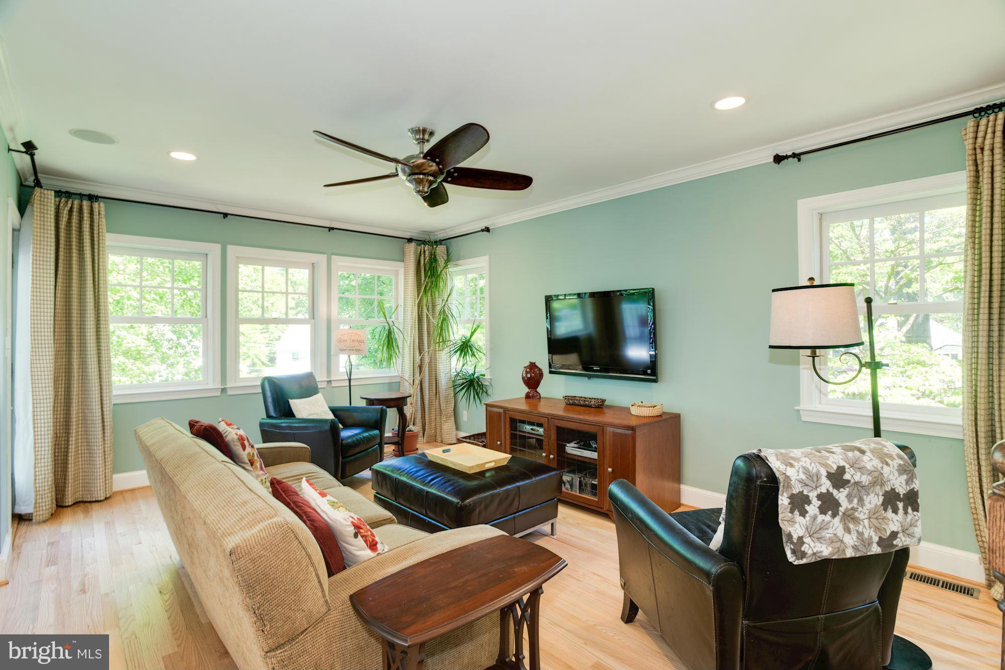 6224 30th Street Northwest Washington, DC 20015 - Photo 12 of 30 a living room with furniture and a flat screen tv