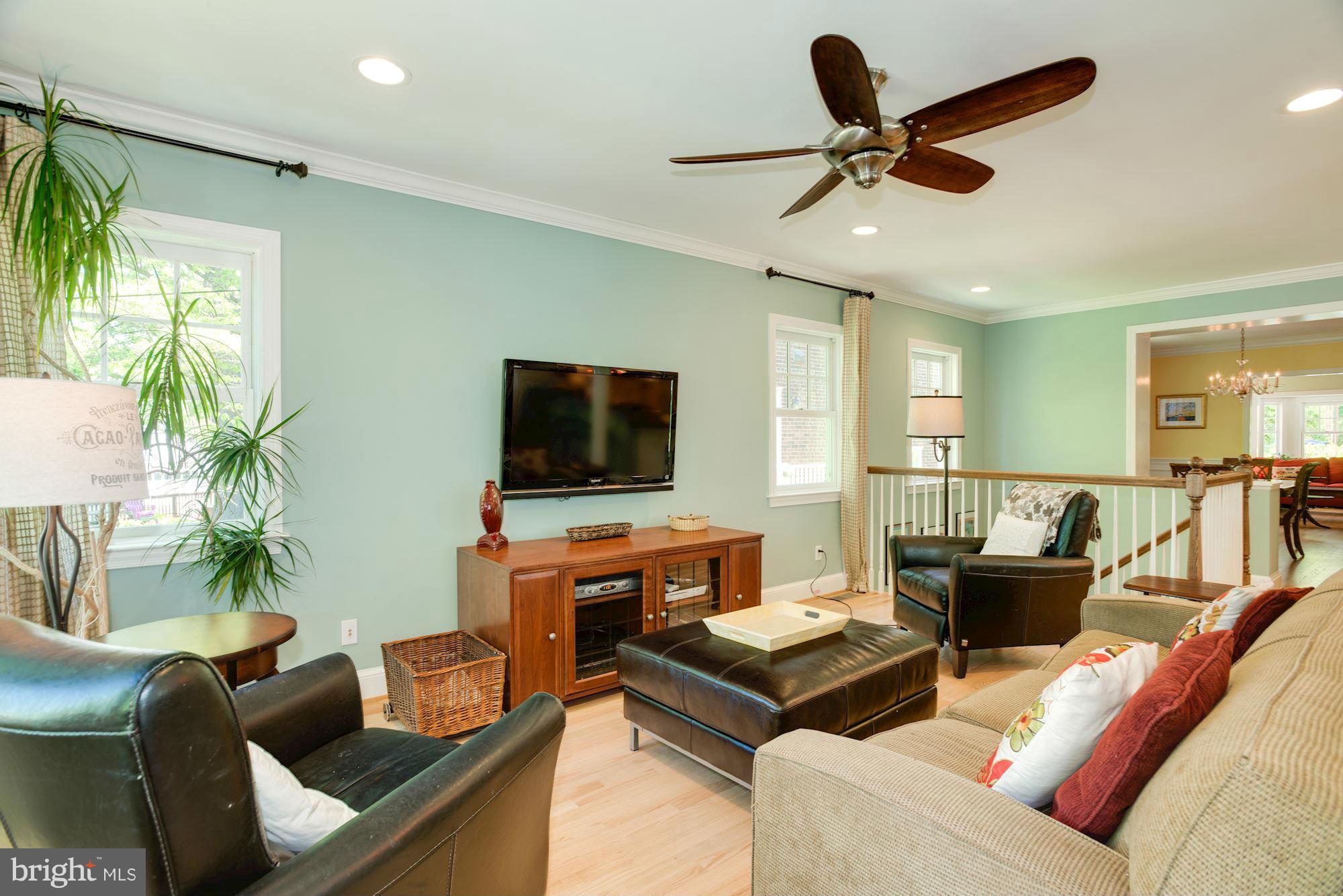 6224 30th Street Northwest Washington, DC 20015 - Photo 13 of 30 a living room with furniture and a flat screen tv