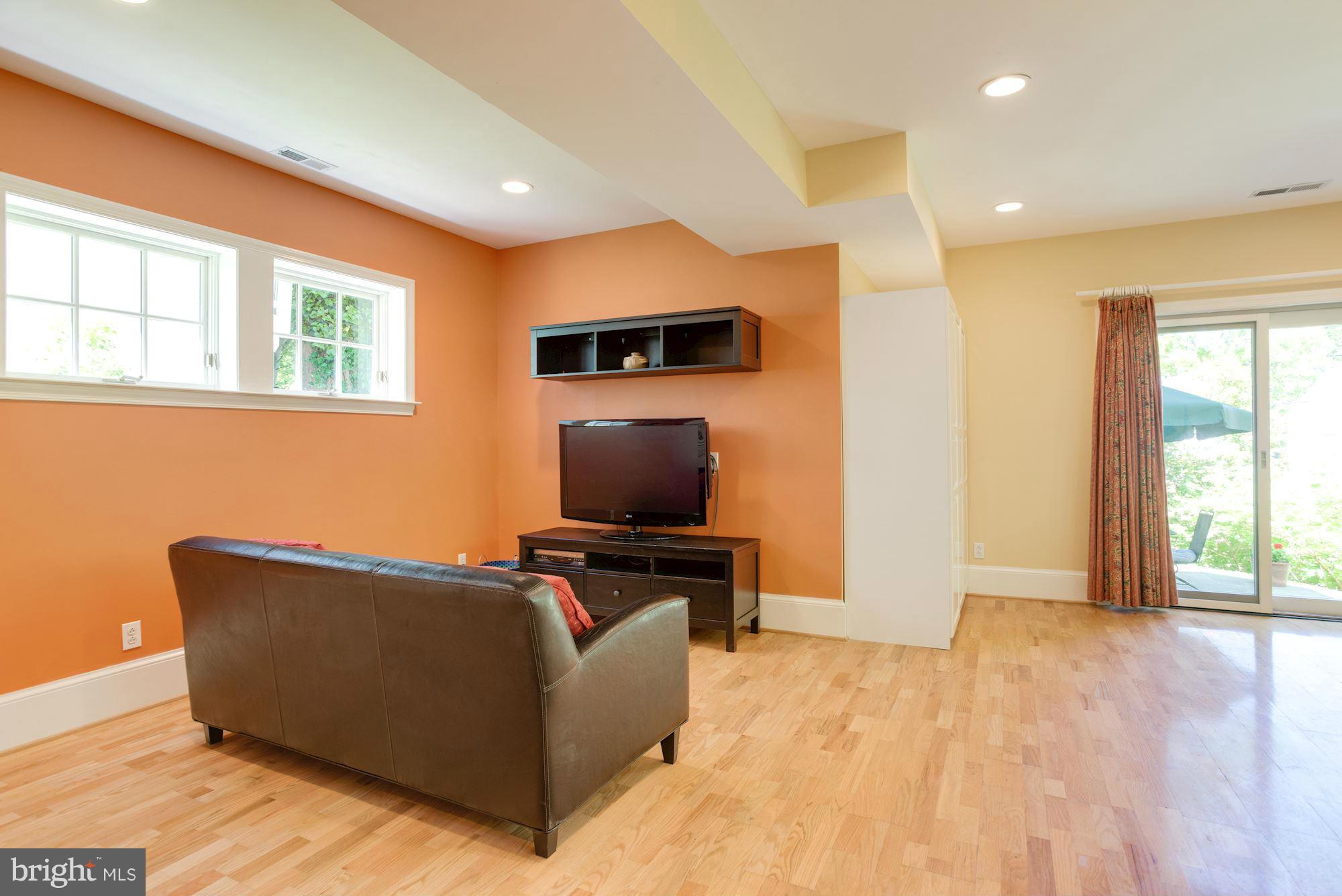 6224 30th Street Northwest Washington, DC 20015 - Photo 26 of 30 a living room with furniture and a flat screen tv
